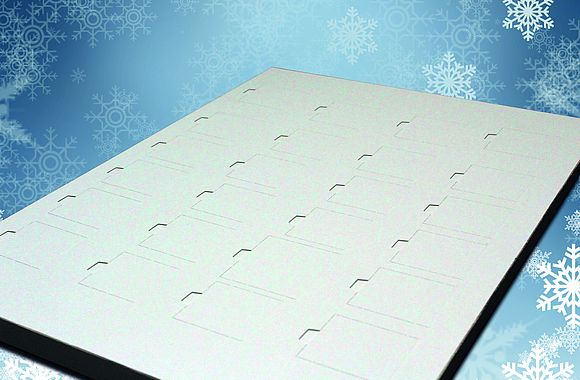 A specially developed calendar construction by MM Karton made out of FOODBOARD™ virgin fibre prevents mineral oil migration in Advent chocolate